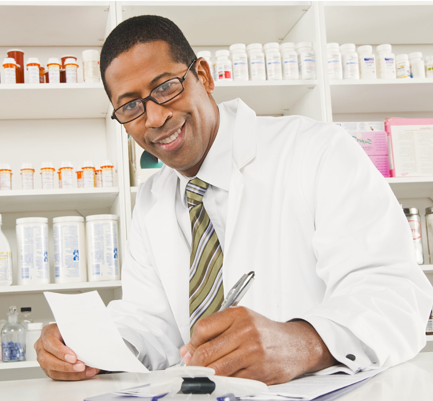 African american male pharmacist working in pharmacy