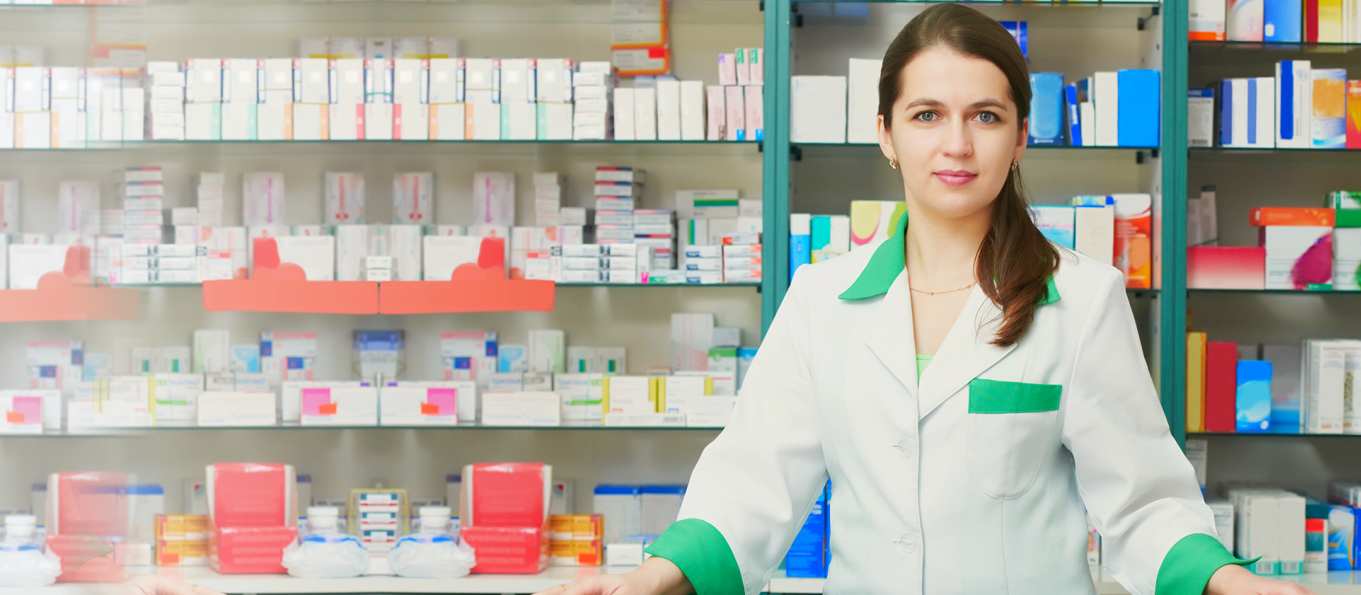 Cheerful pharmacist chemist woman standing in pharmacy drugstore