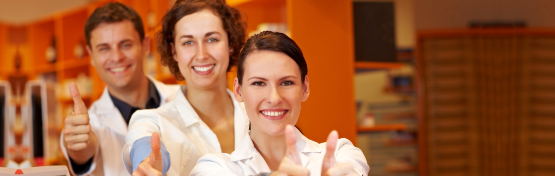 group of pharmacists showing thumbs up